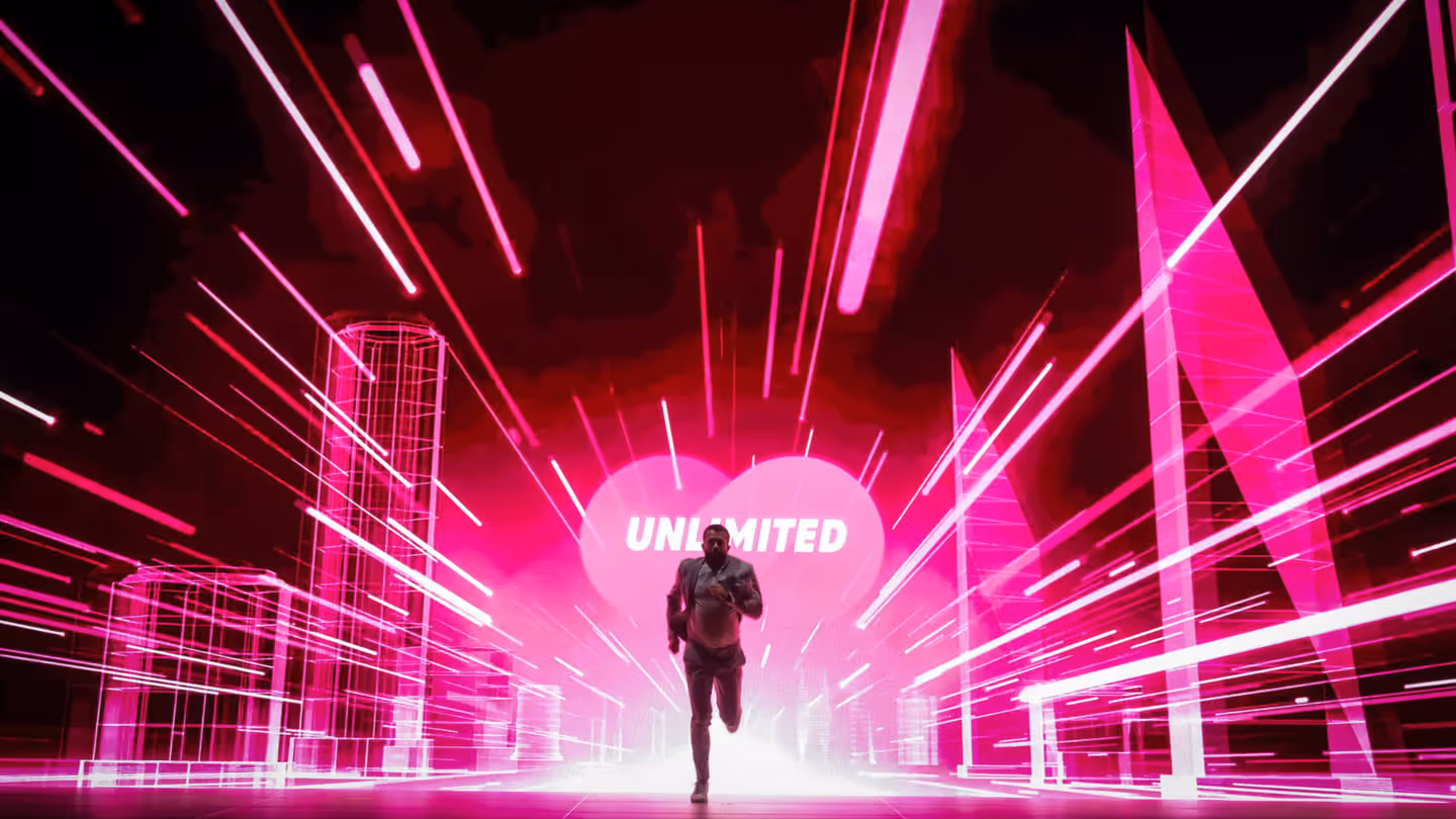 Mann im Anzug läuft vor leuchtend pinken, futuristischen Stadtgebäuden mit dem Wort UNLIMITED im Hintergrund.