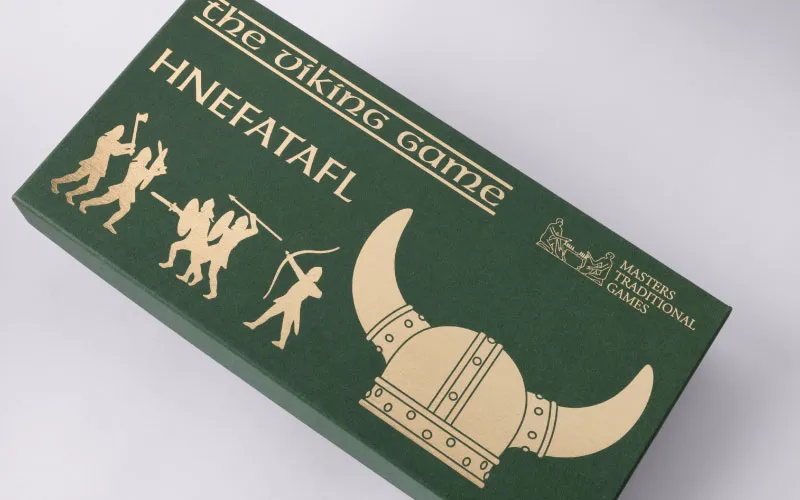 Green box for the Viking game with gold Viking helmet and warrior silhouettes.