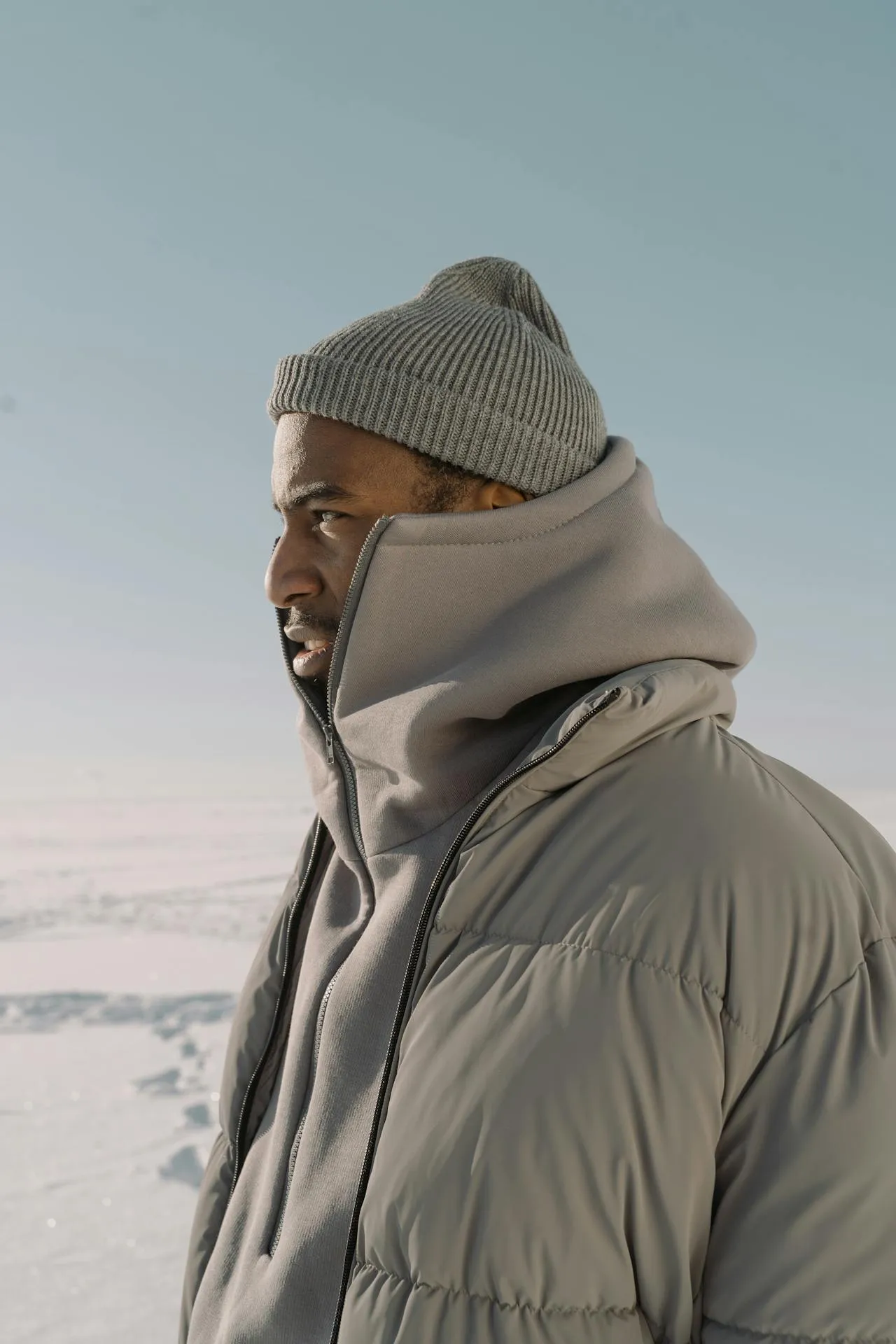 Guy rocking a gray jacket from Sinners winter collection