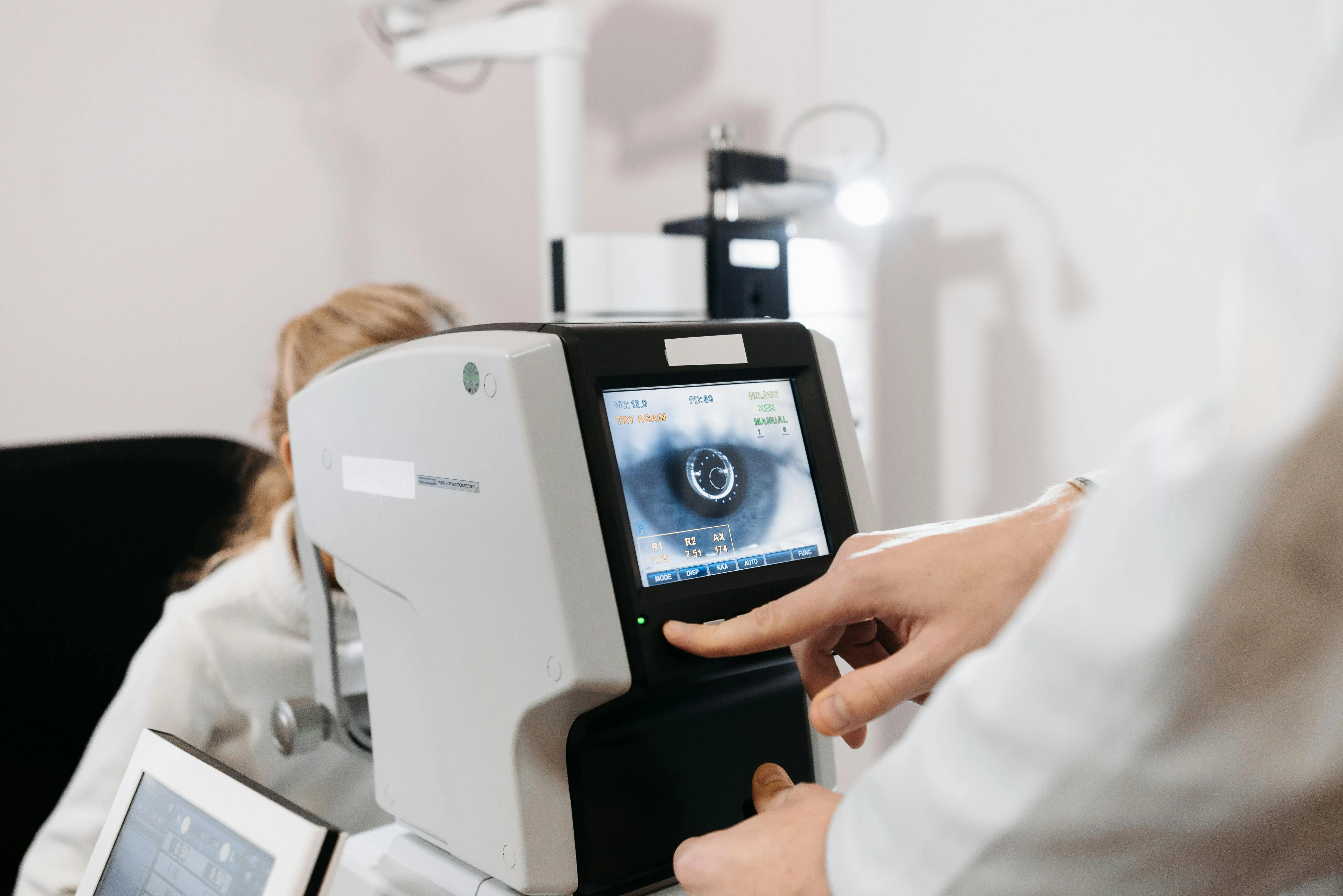 Eye examination with digital retinal scanning machine in medical clinic