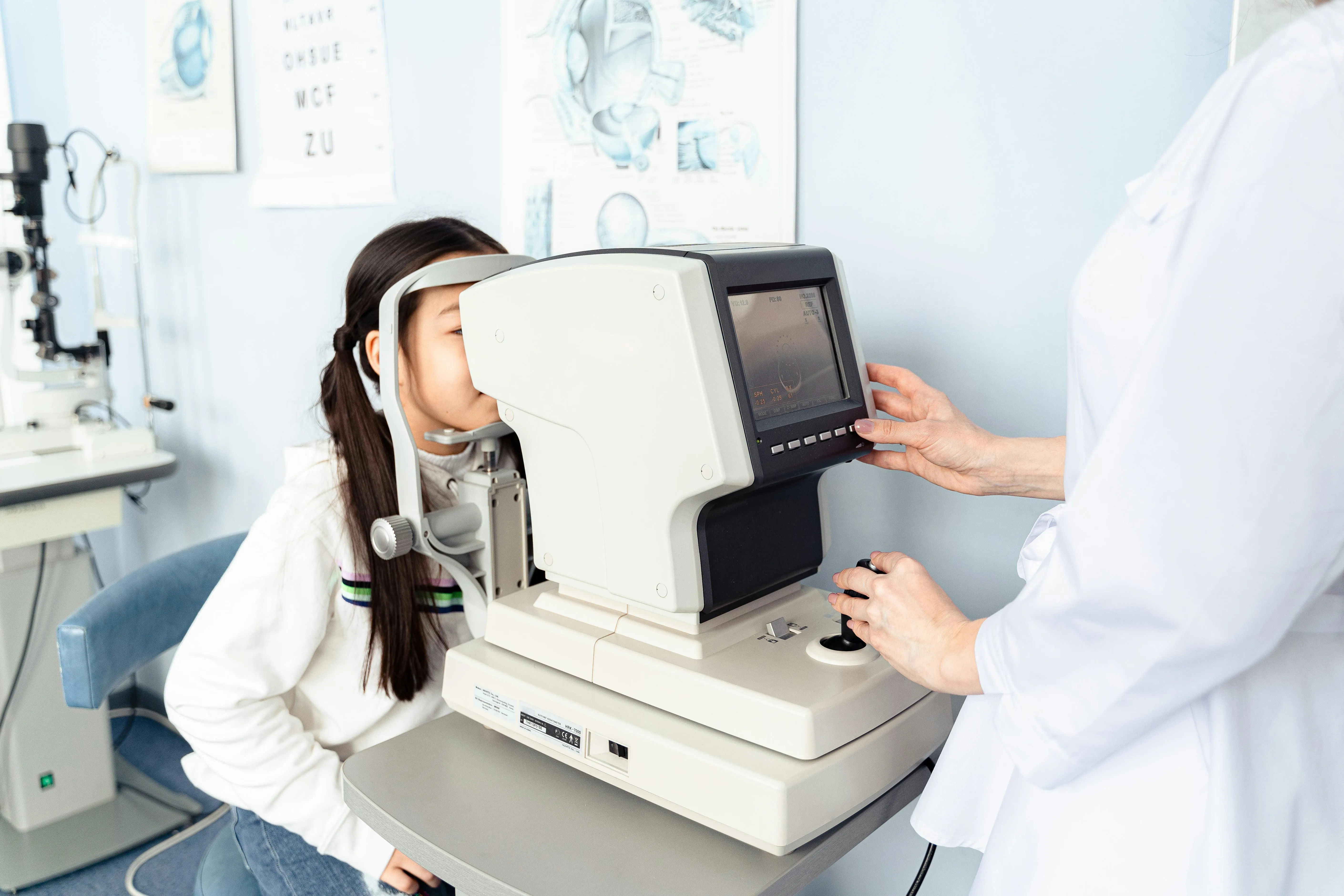 Eye exam with professional using advanced optical diagnostic equipment