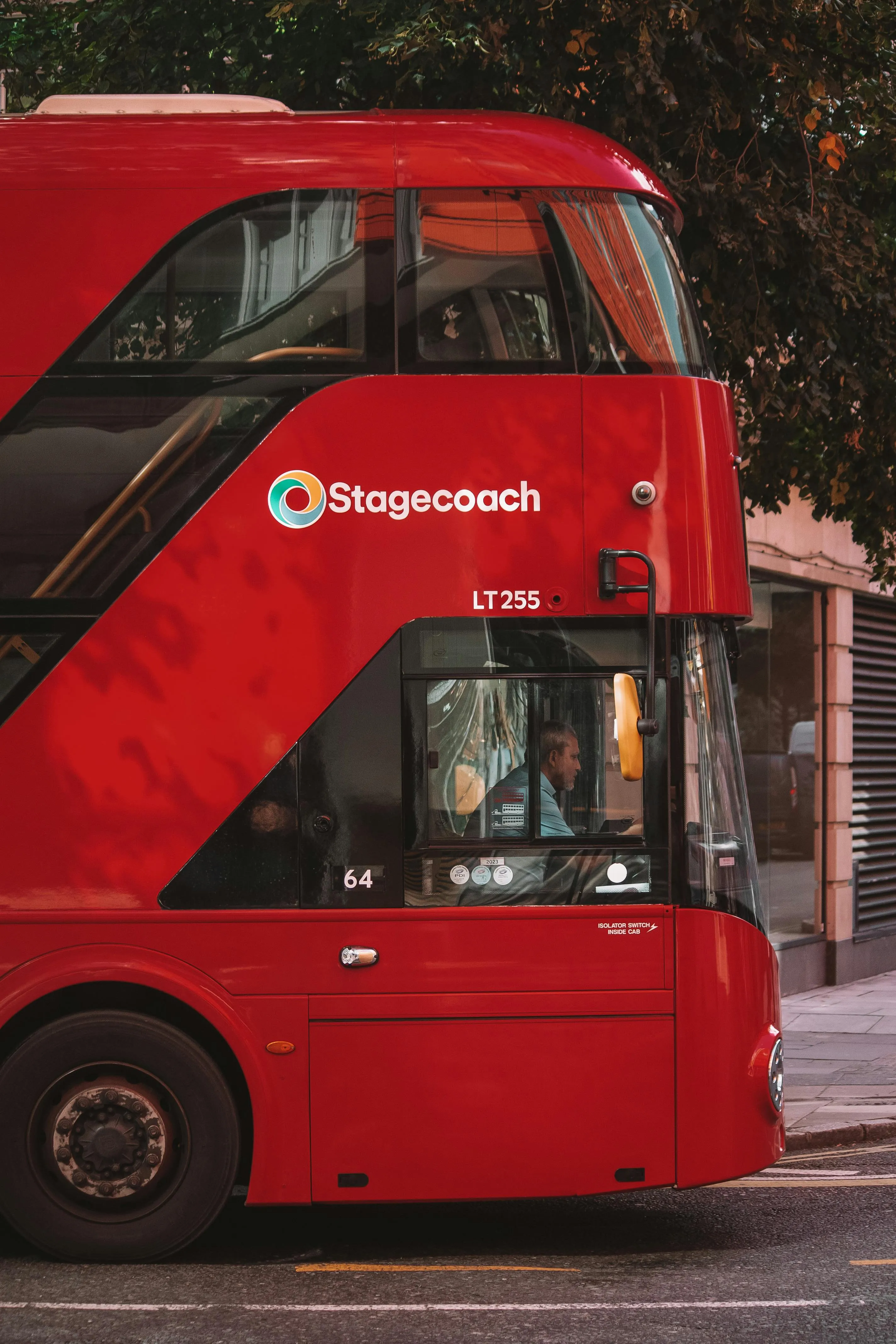 Bright red Stagecoach double-decker bus parked on city street