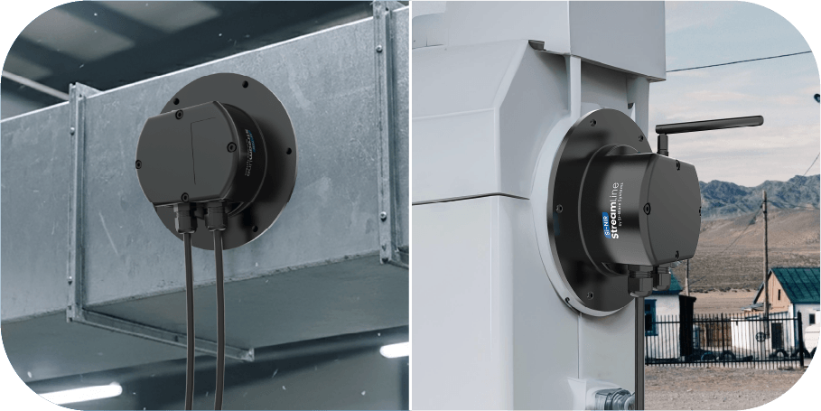 Two black Envir streamLine air quality sensors mounted on metal ducting and outdoor equipment with cables attached.