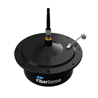 Black circular FiberSense device with an antenna and a small metal lever on top.