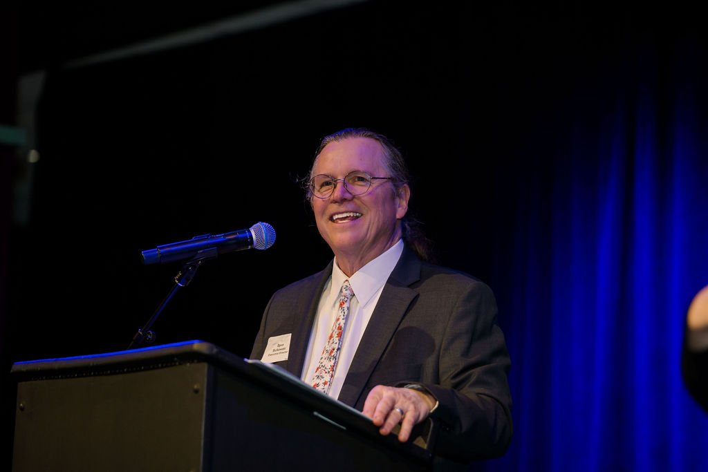 Dave speaking on stage