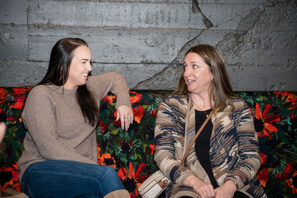 two guests chatting with each other 