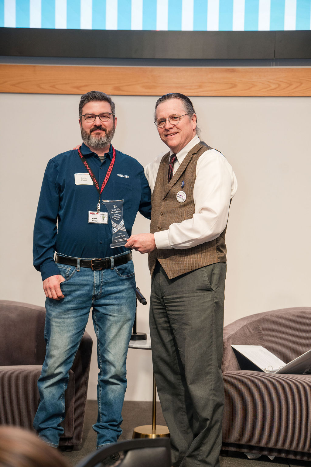 dave presenting aaron with volunteer of the year award