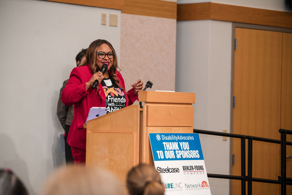 Monica Sparks speaking on stage