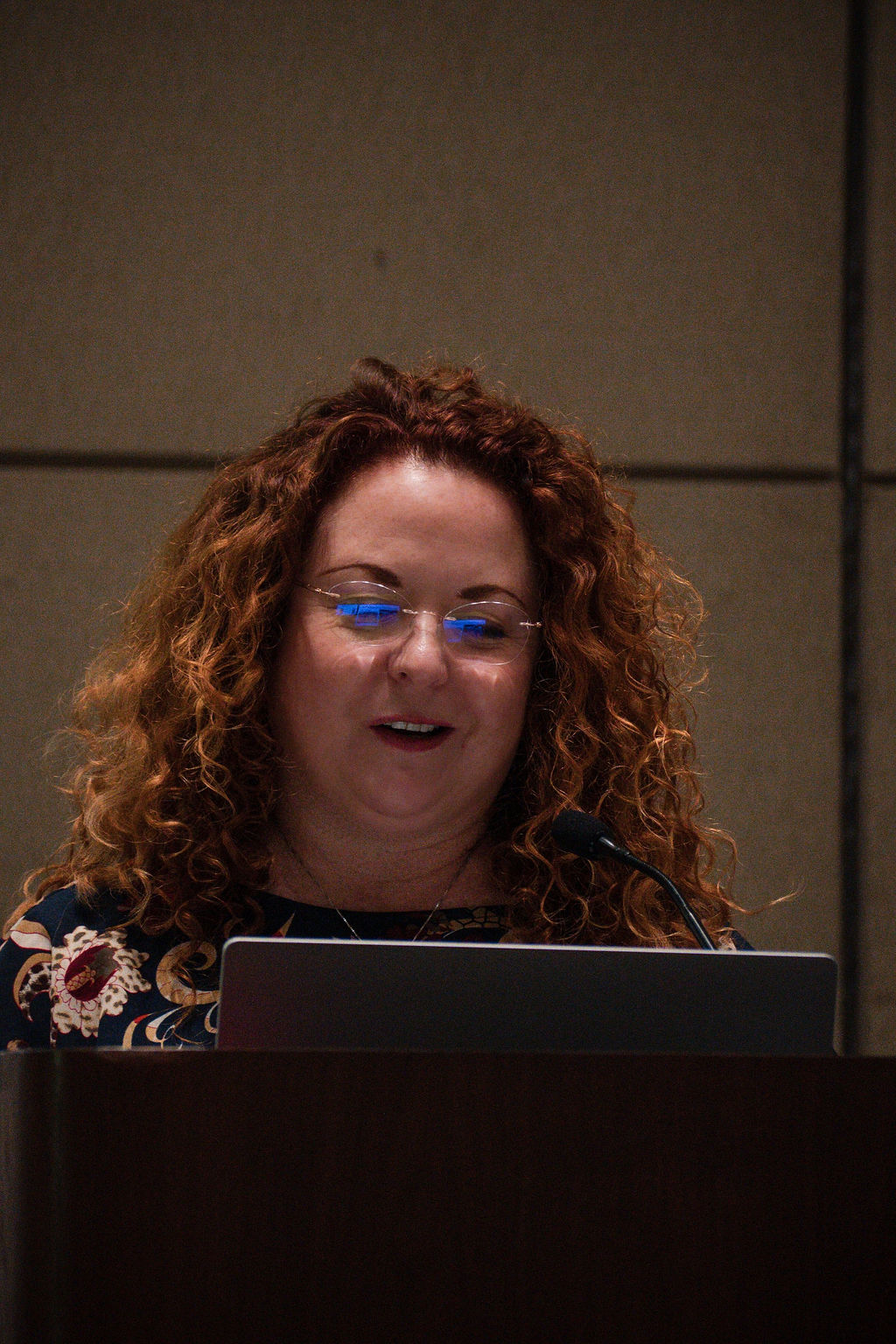 Suzanne speaking on stage