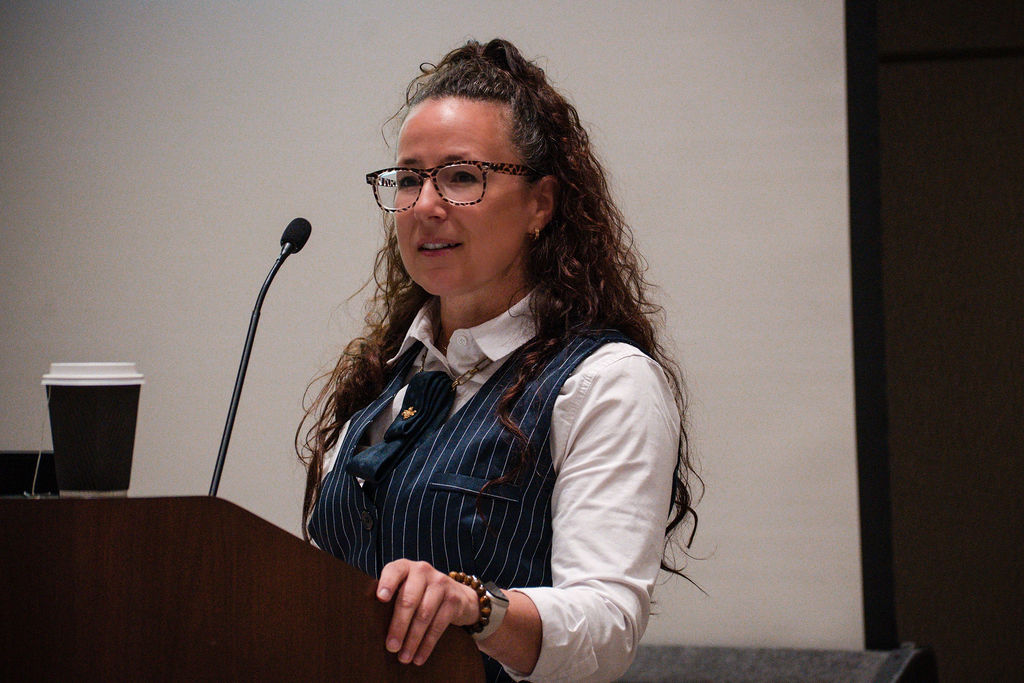Sarah speaking on stage