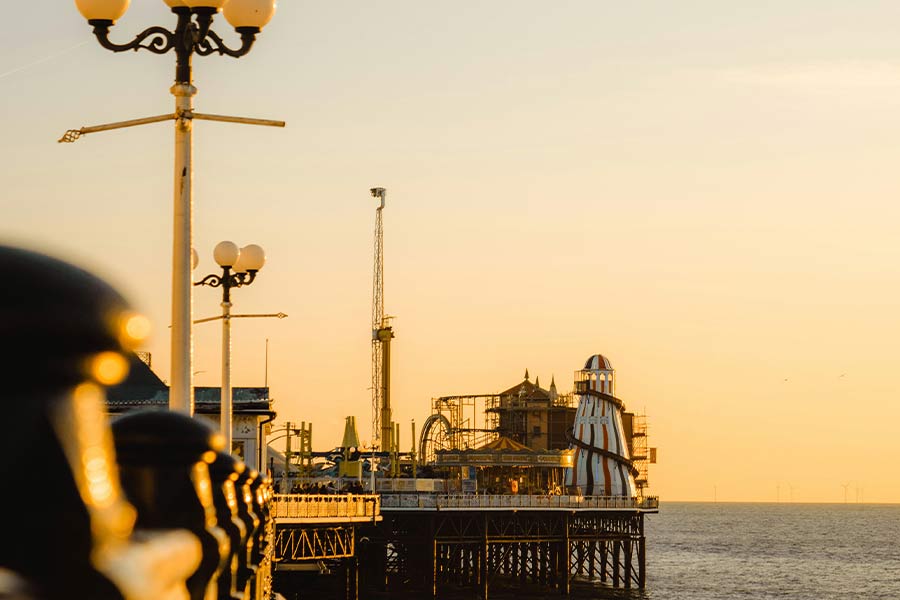 Brighton Pier in the sunset, Brighton Holiday blog post image. Photo by Rhys Kentish on Unsplash.