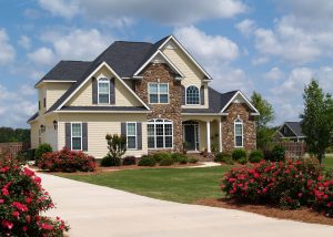 Picture of a house with beige vinyl siding.
