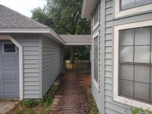 Exterior view of a home with blue vinyl siding
