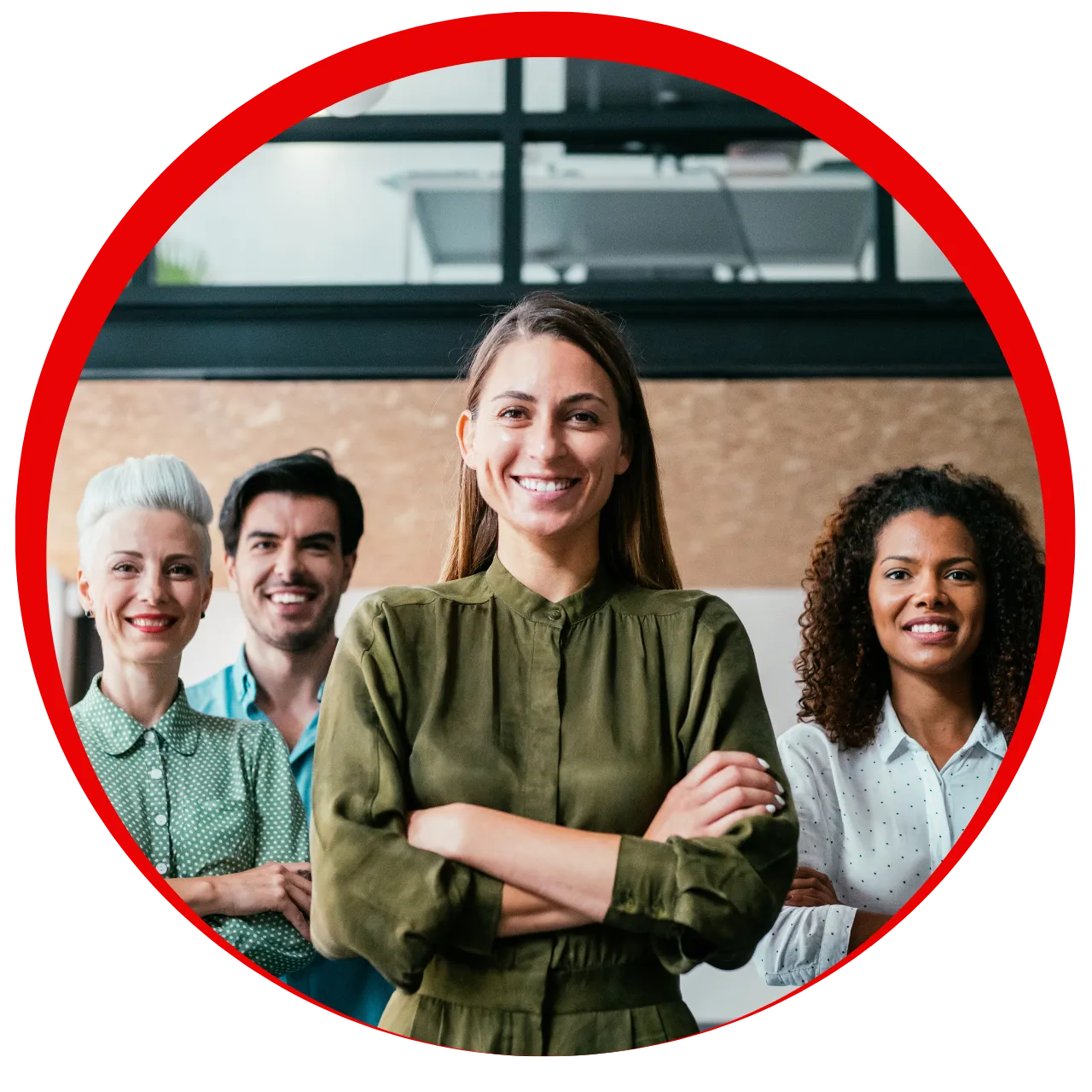 Four diverse colleagues standing in an office, smiling confidently with arms crossed.