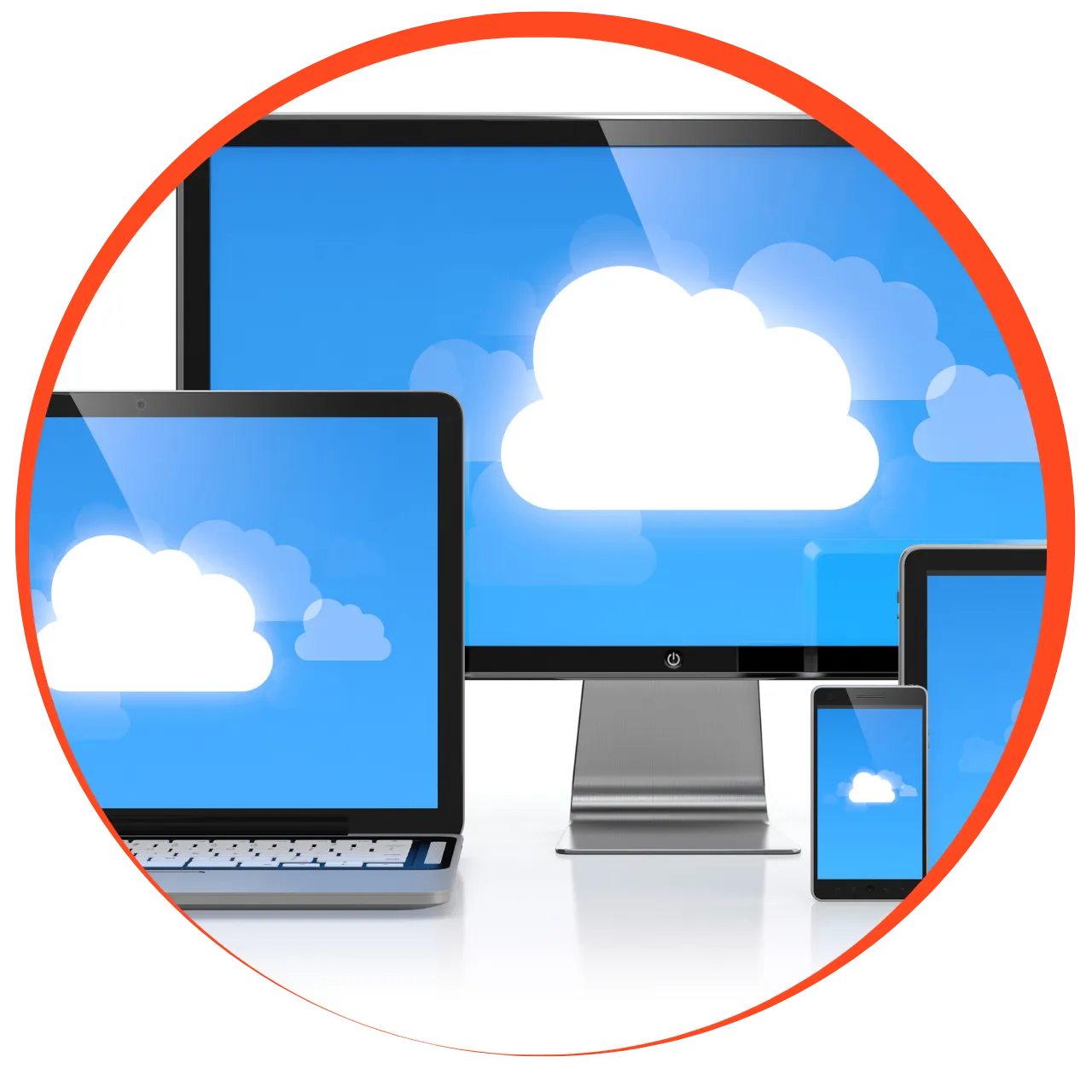 Desktop monitor, laptop, tablet, and smartphone displaying white cloud icons on blue backgrounds, representing cloud computing.