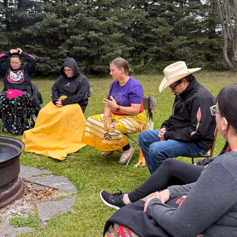 People in a circle outside with Karlee