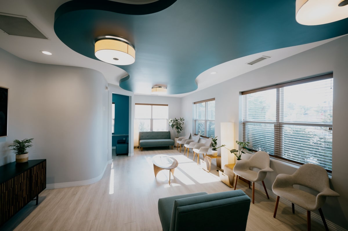 Modern dental treatment room with bright lighting, clean white cabinetry, and contemporary design at Springs Valley Dentistry