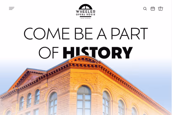 The Wheeler Opera House homepage banner with the words "Come be a part of history" and the exterior of the building.