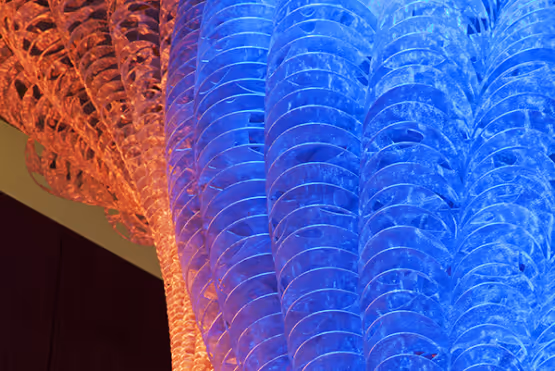 Close-up of a vibrant red and blue translucent sculpture.
