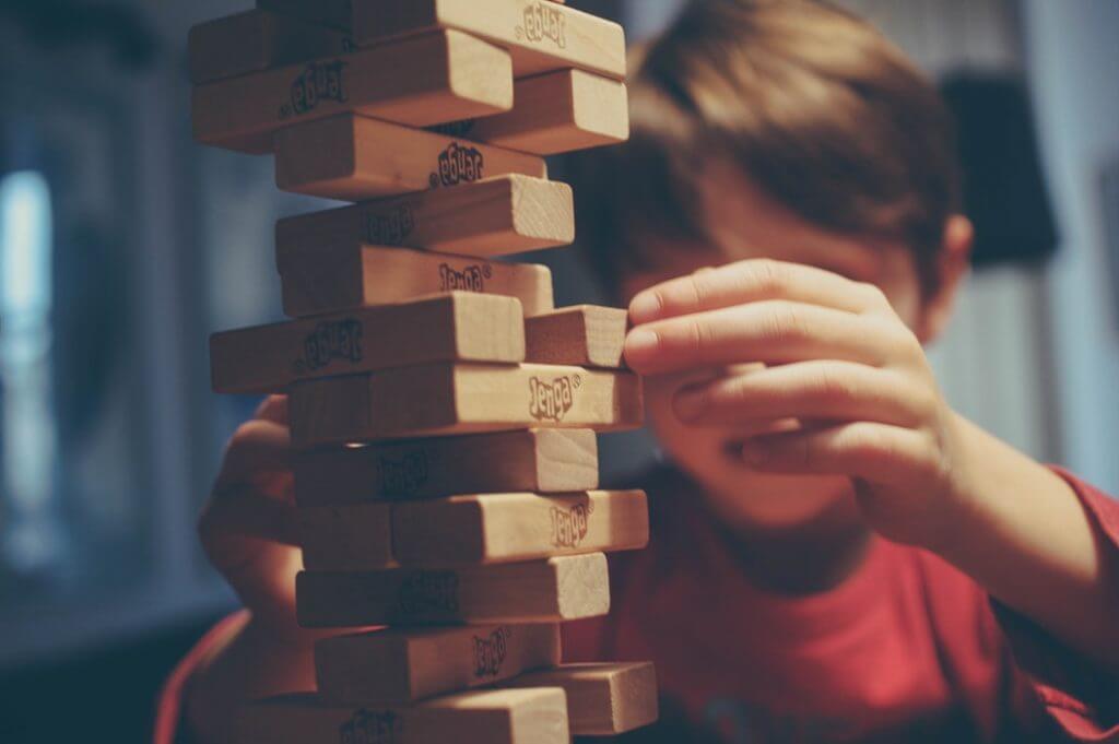 kid playing jenga
