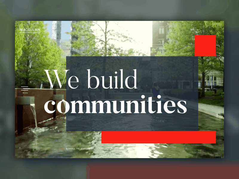 Magellan Development Group homepage hero reading "We build communities" over a landscaped courtyard with a water feature