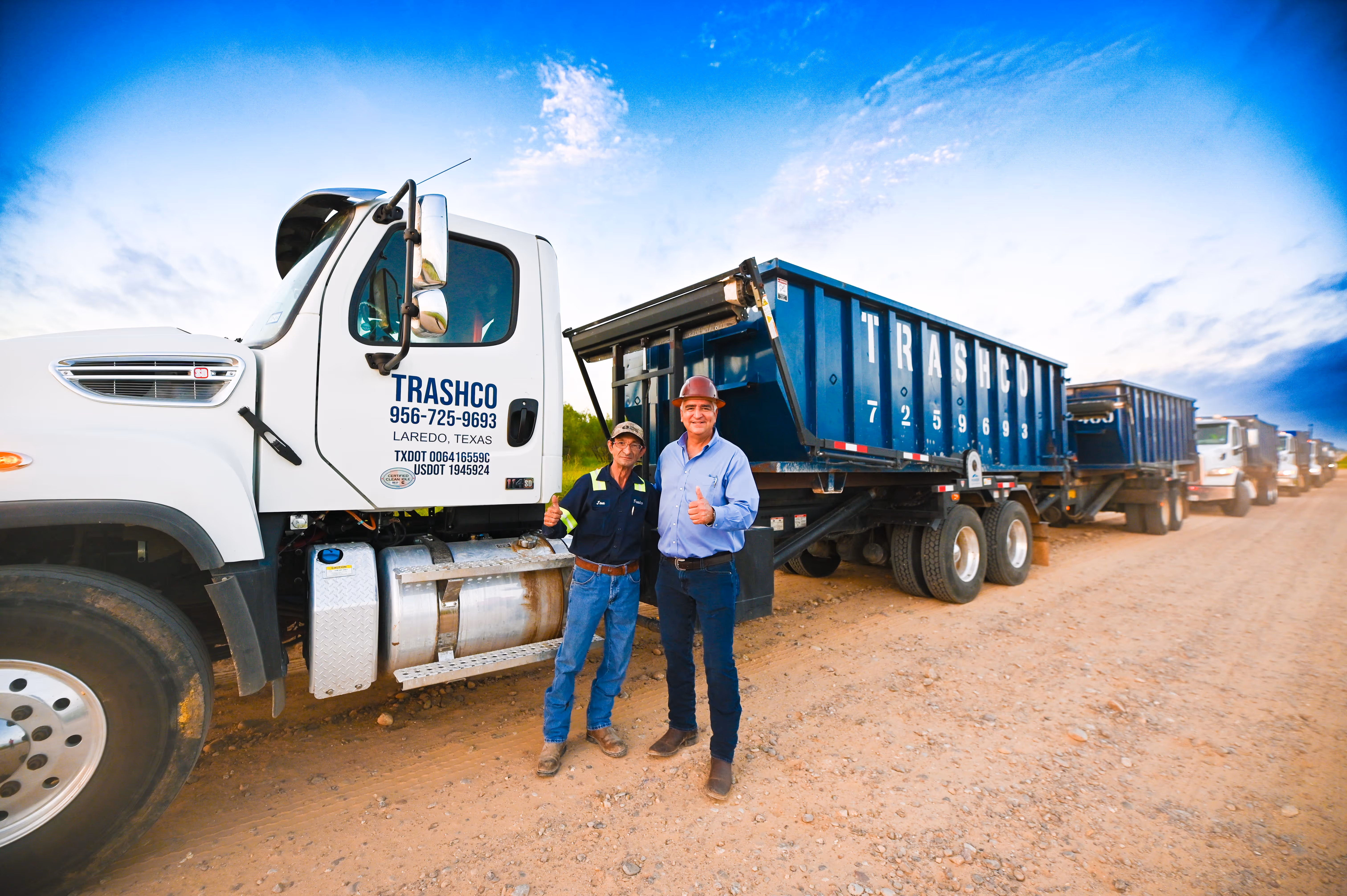 Trashco team in front of a Trashco truck