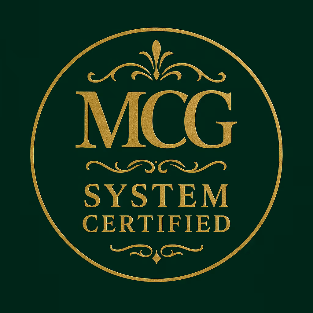 Gold emblem with ornamental flourishes reading 'MCG SYSTEM CERTIFIED' on a dark green background.