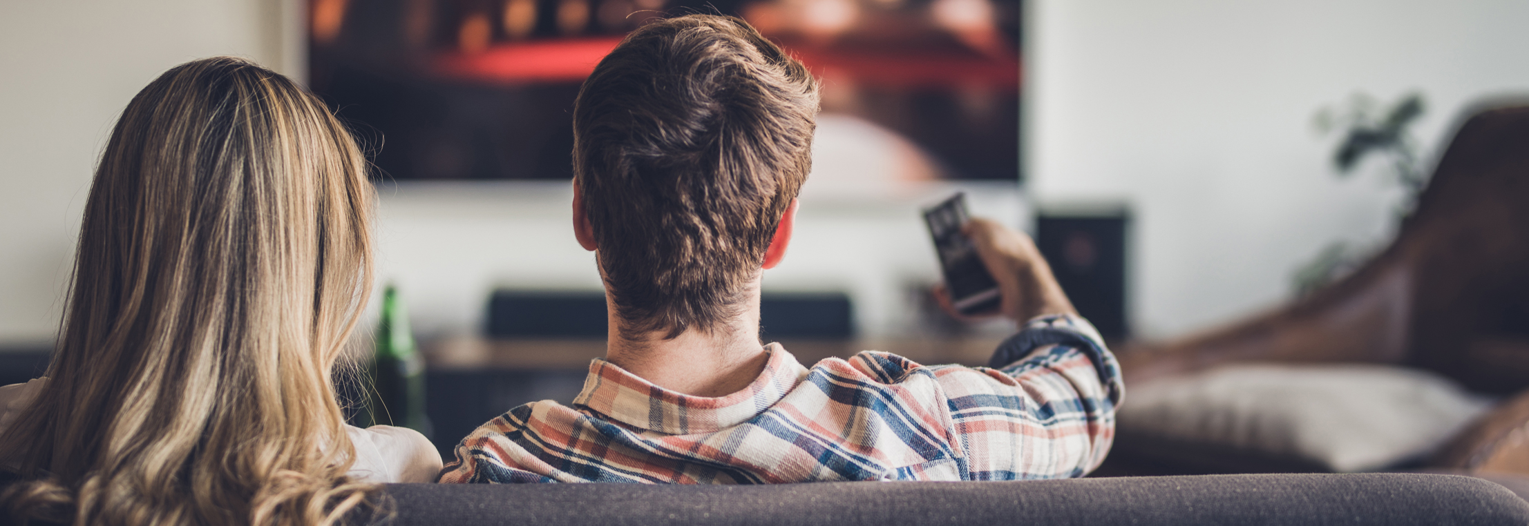 Two people watching tv