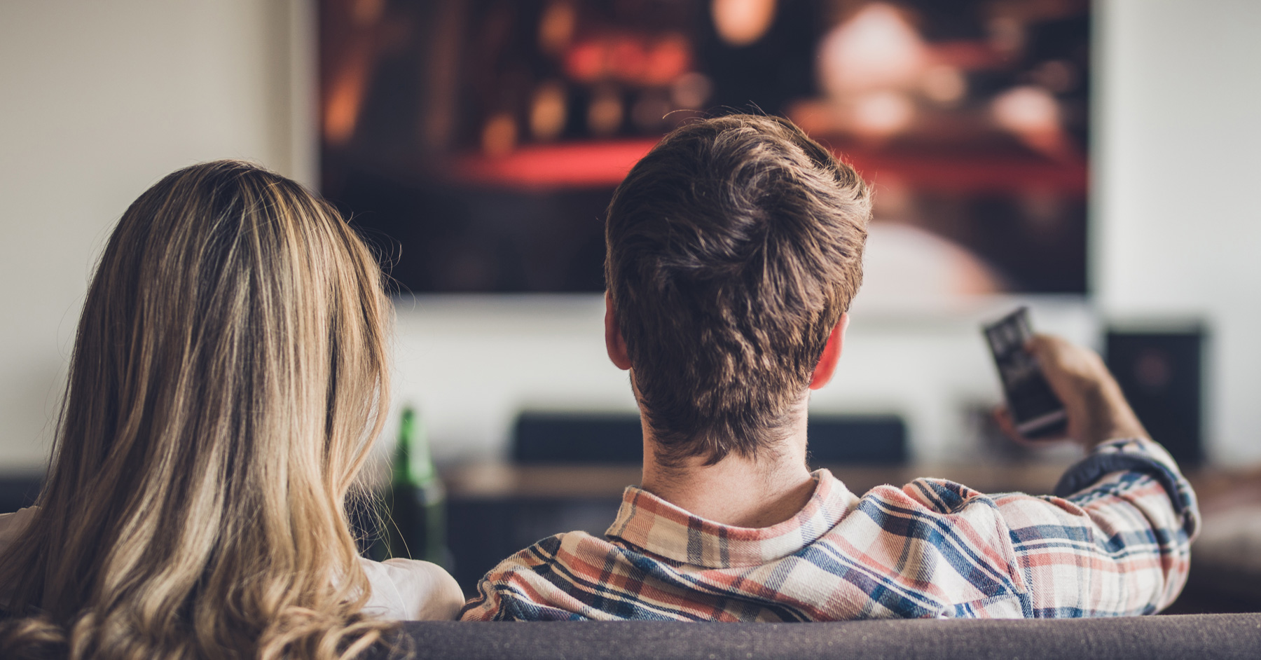 Two people watching tv