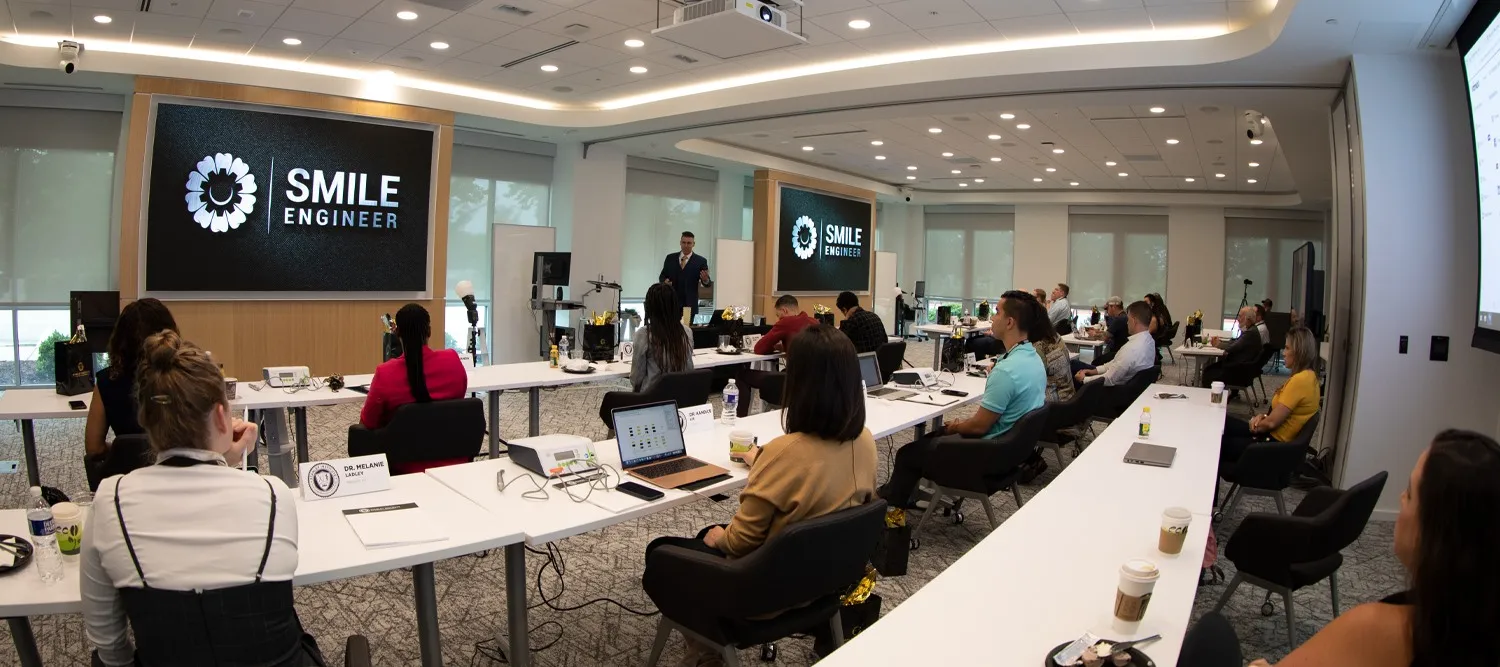 Smile Engineer training session with presenter and attendees in modern classroom