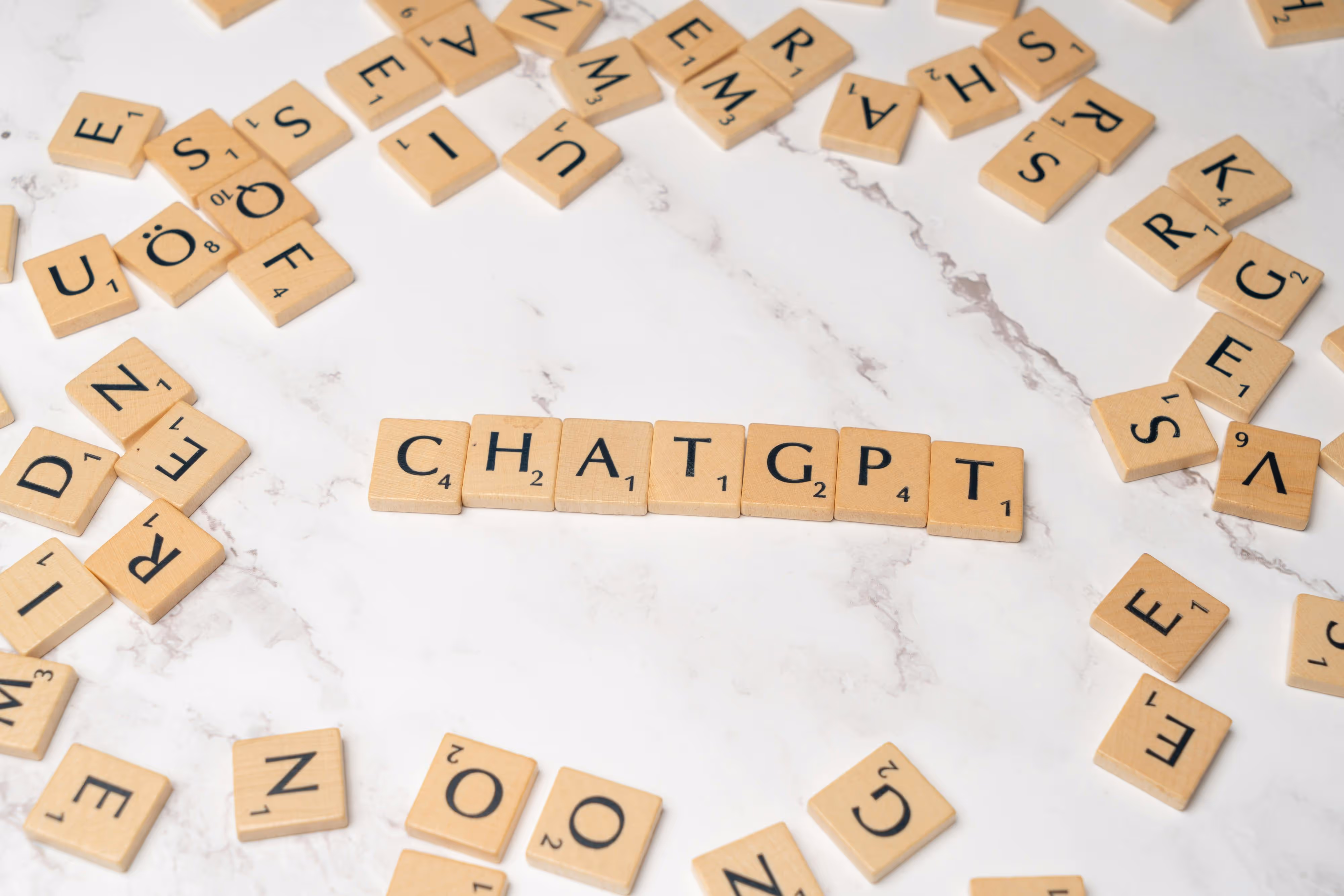 scrabble letters spelling "Chat GPT"