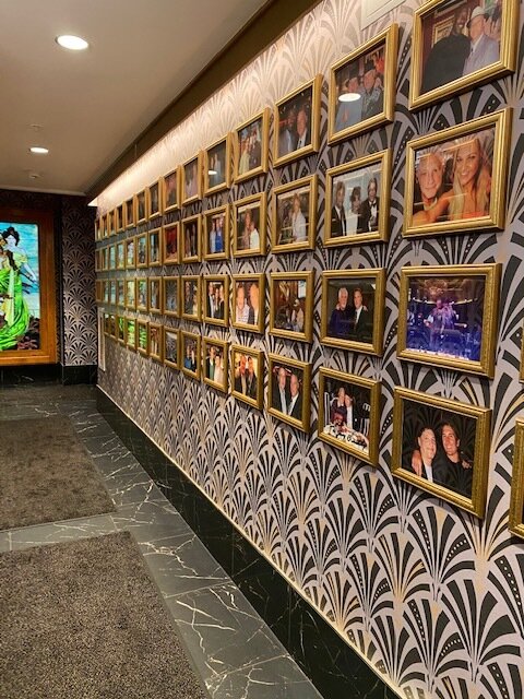 Classic steakhouse flex: the celebrity gallery wall