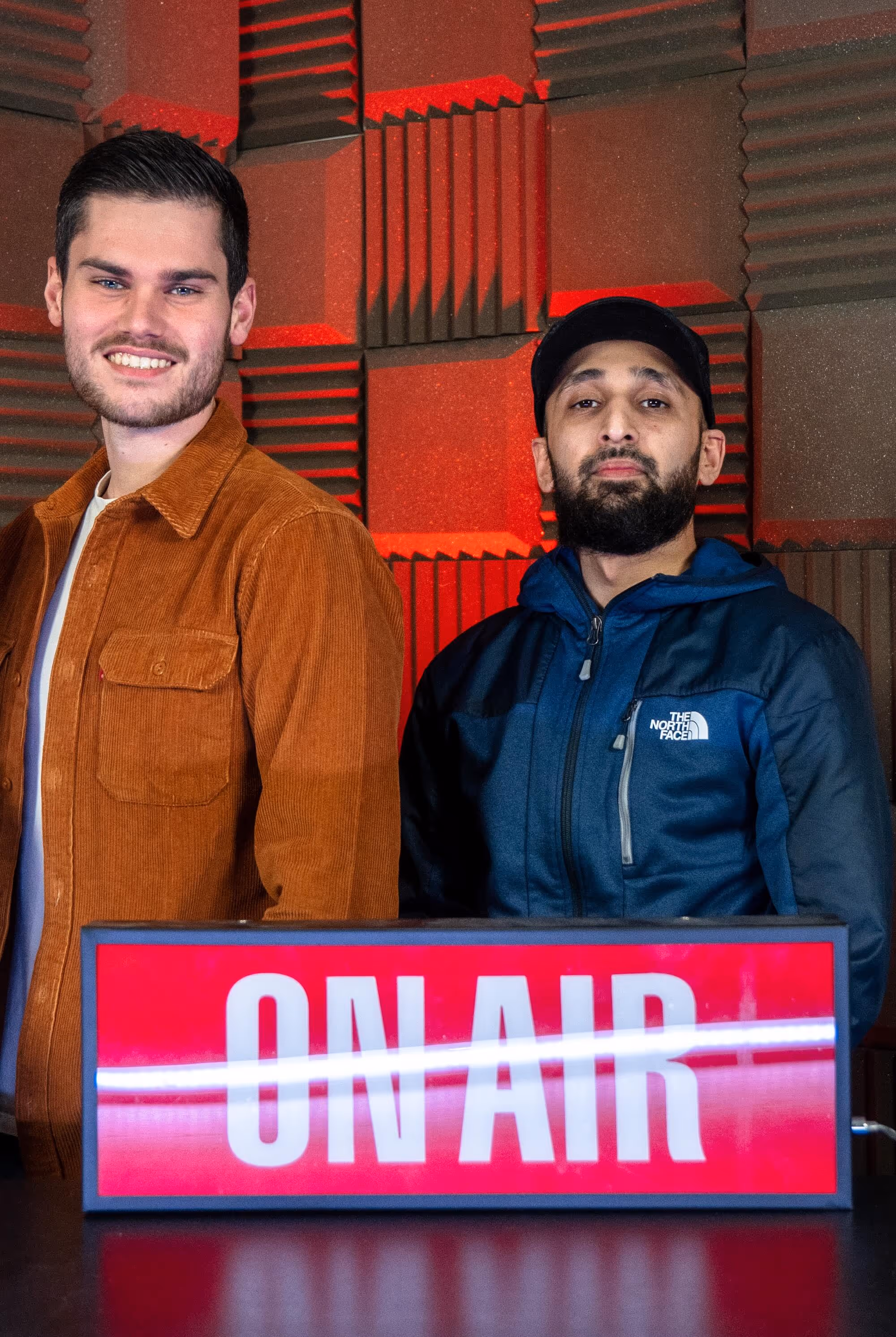 Radio.co team members, James Brown and Qasim Ahmed, posing for a photo.
