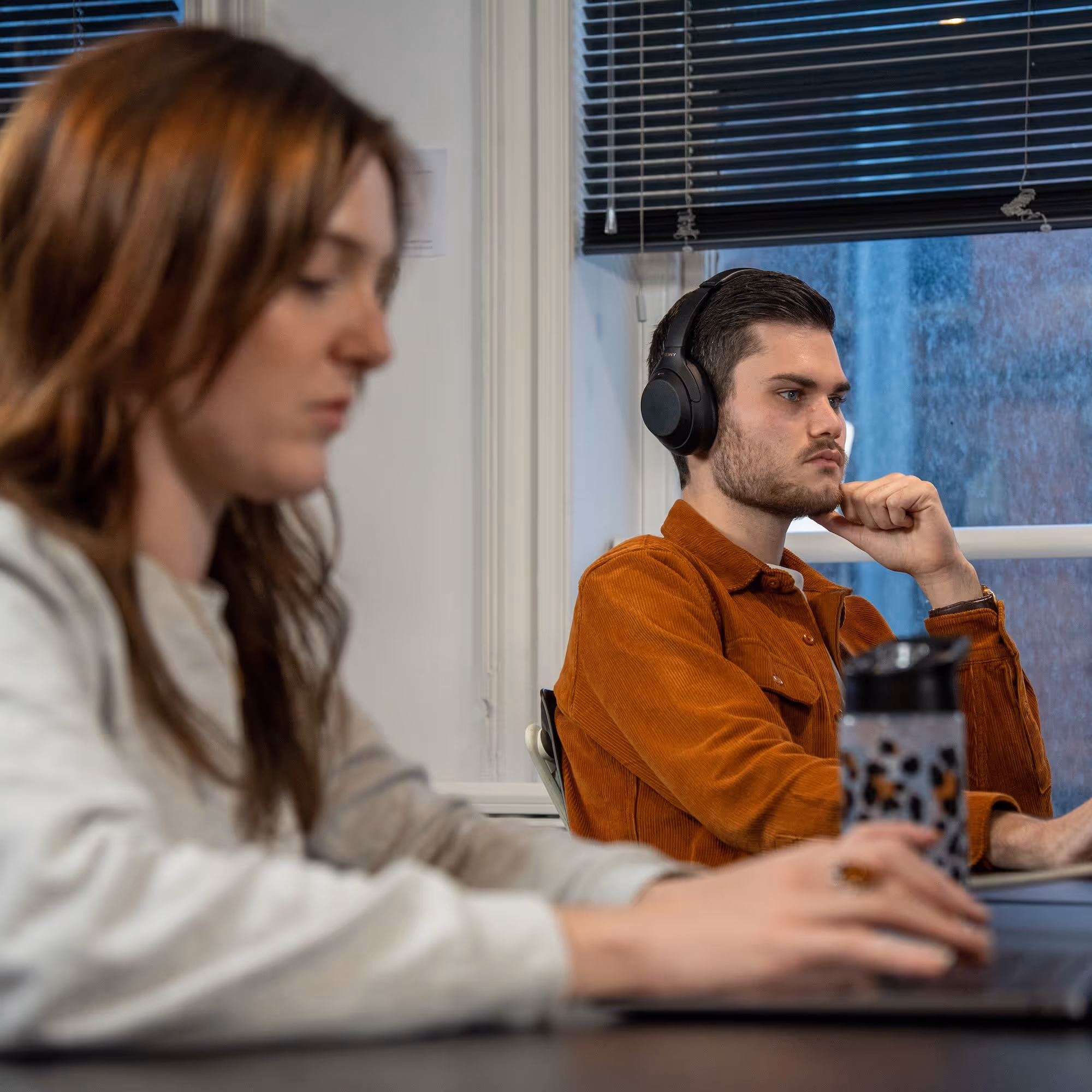 Working hard, Radio.co team members James Brown and Amber Macdonald at work in the office.