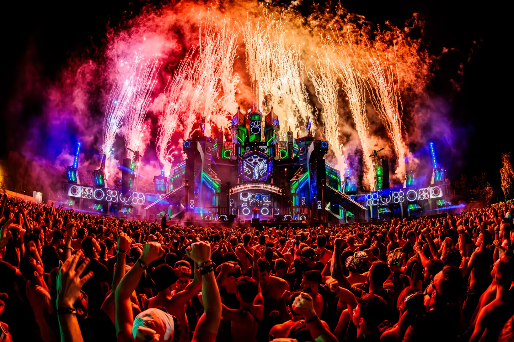 Decibel Outdoor festival with massive stage, fireworks, and energetic crowd