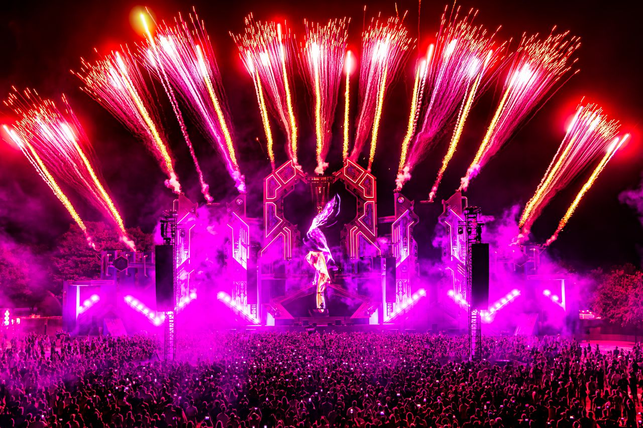 Decibel Outdoor festival with massive crowd, stages, and colorful attractions