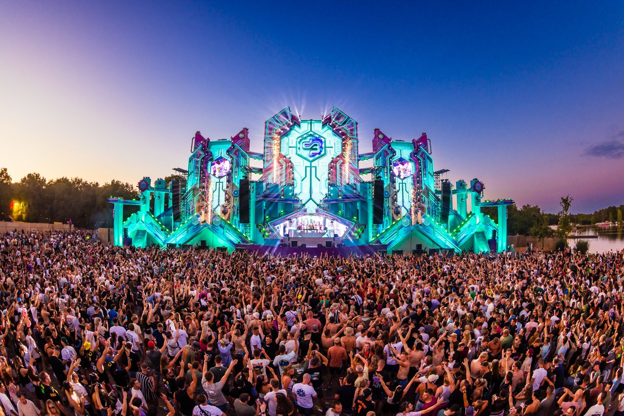 Savage Sunday outdoor music festival with massive crowd and fiery stage pyrotechnics