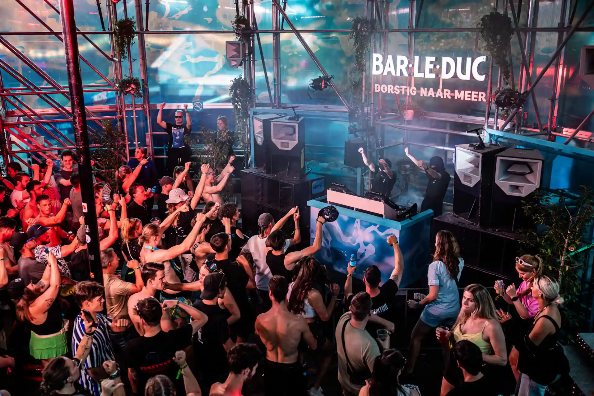 Decibel Outdoor Bar Le Duc music festival with energetic crowd dancing