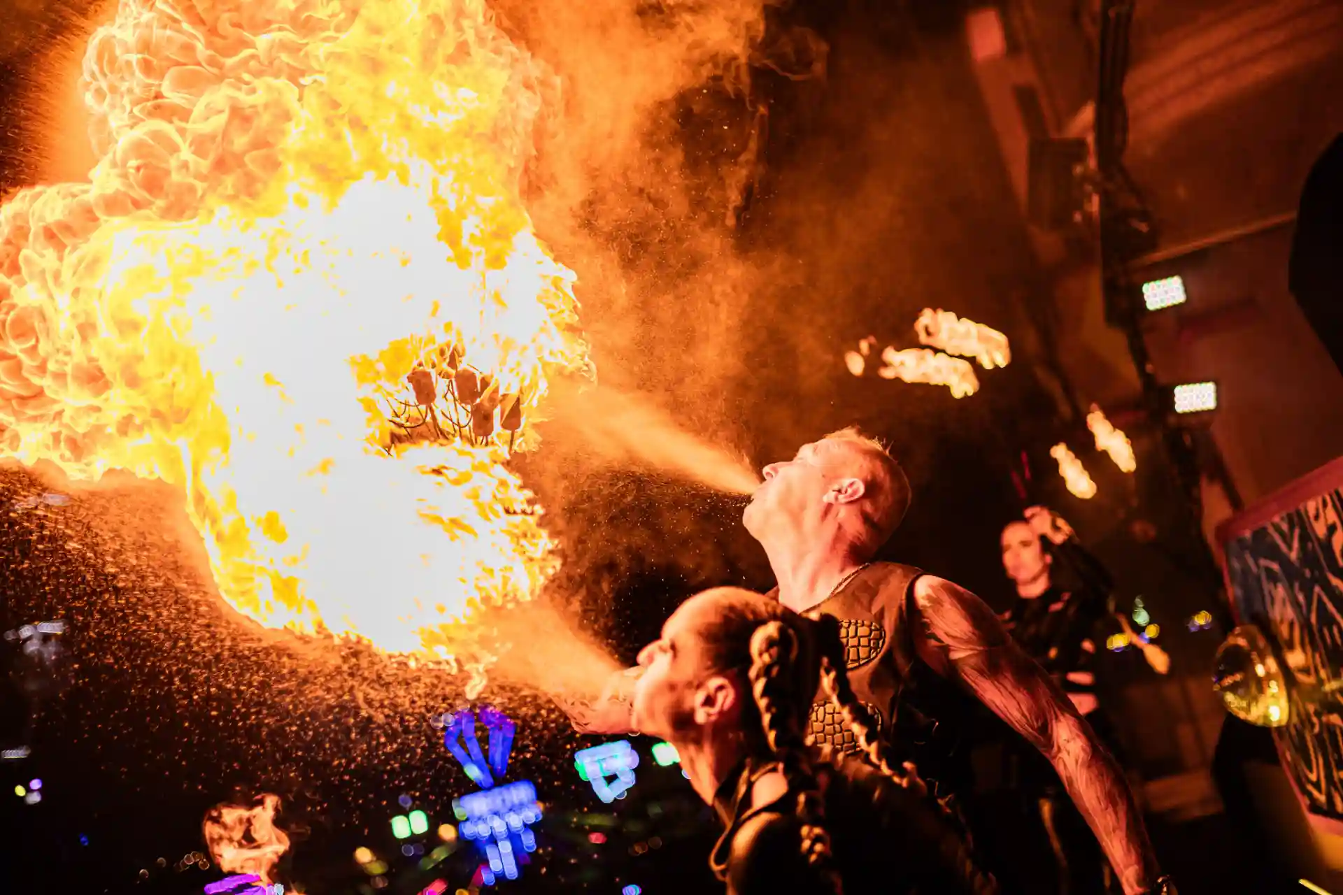 Decibel Outdoor festival performers blowing massive flames on stage