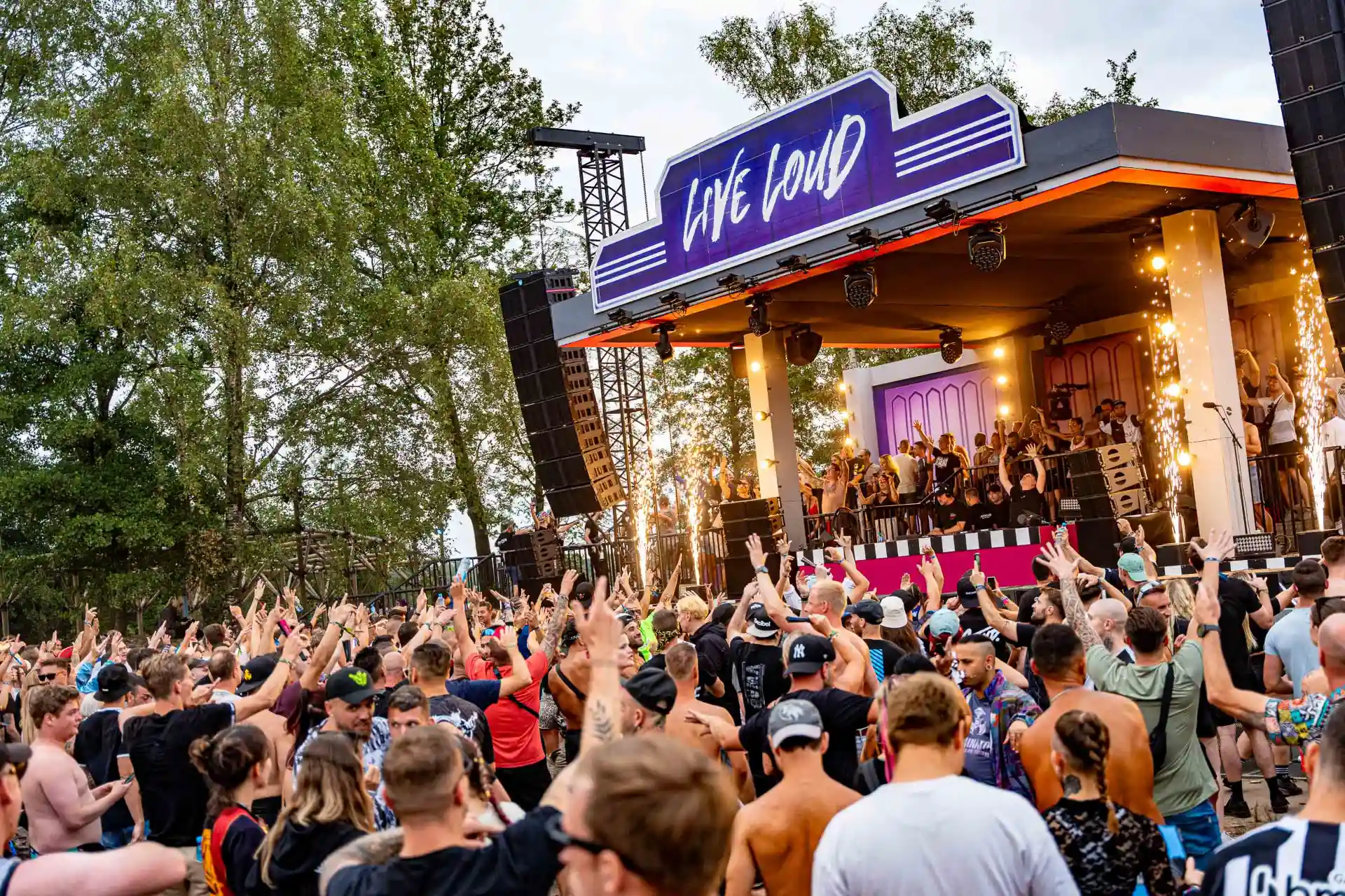 Decibel Outdoor festival crowd cheering at Live Loud stage with raised hands
