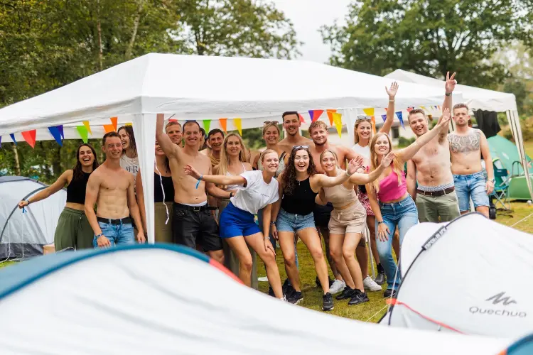 Another group of people at lakeside campsite, friends field