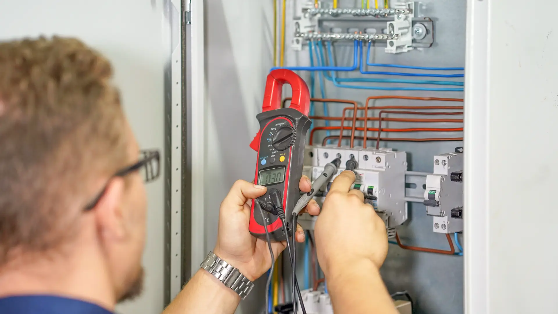 electrician working on panel
