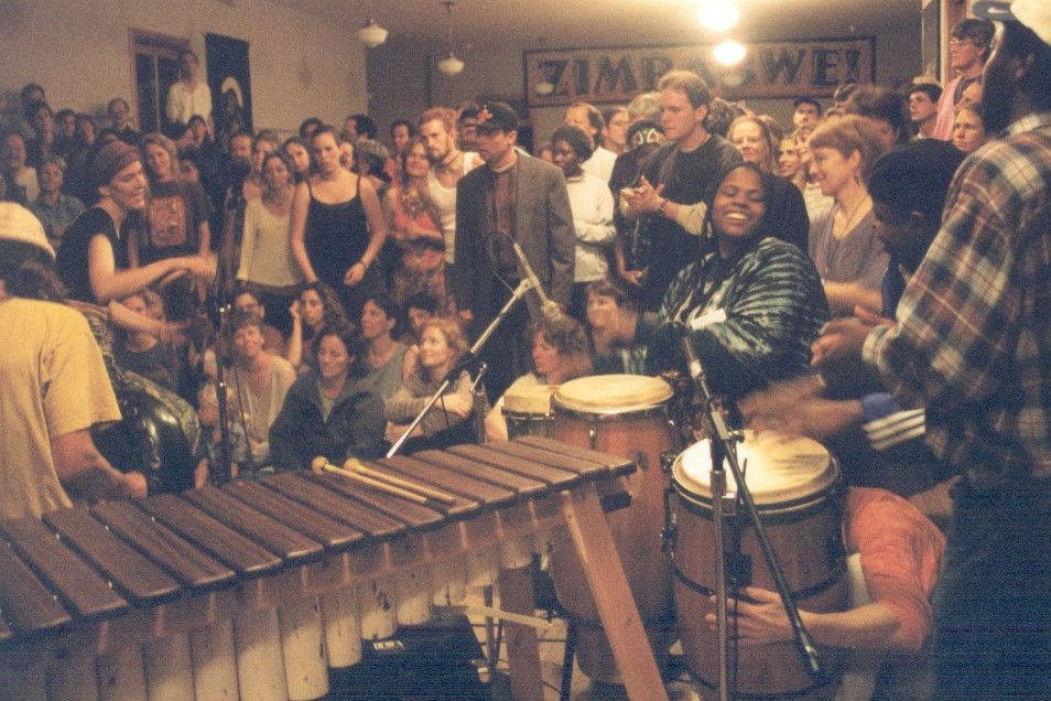 People enjoy a musical performance of traditional Zimbabwean music.