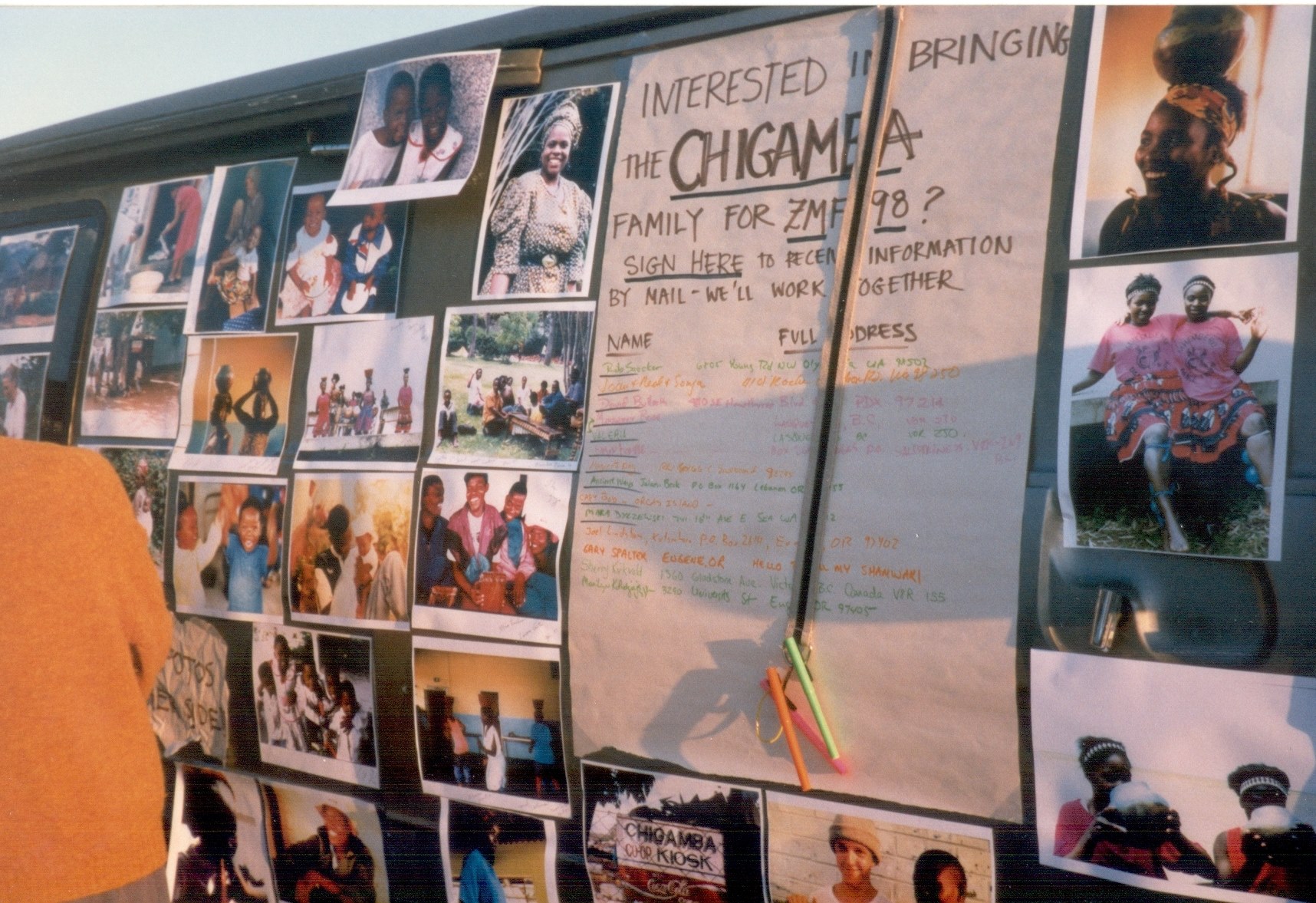 A bulletin board featuring a petition to bring the Chigamba family to Zimfest 1998.