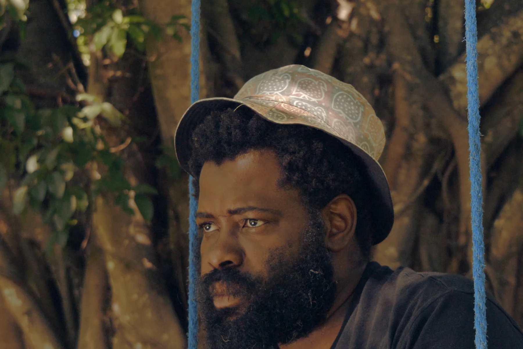 A man stares into the distance.