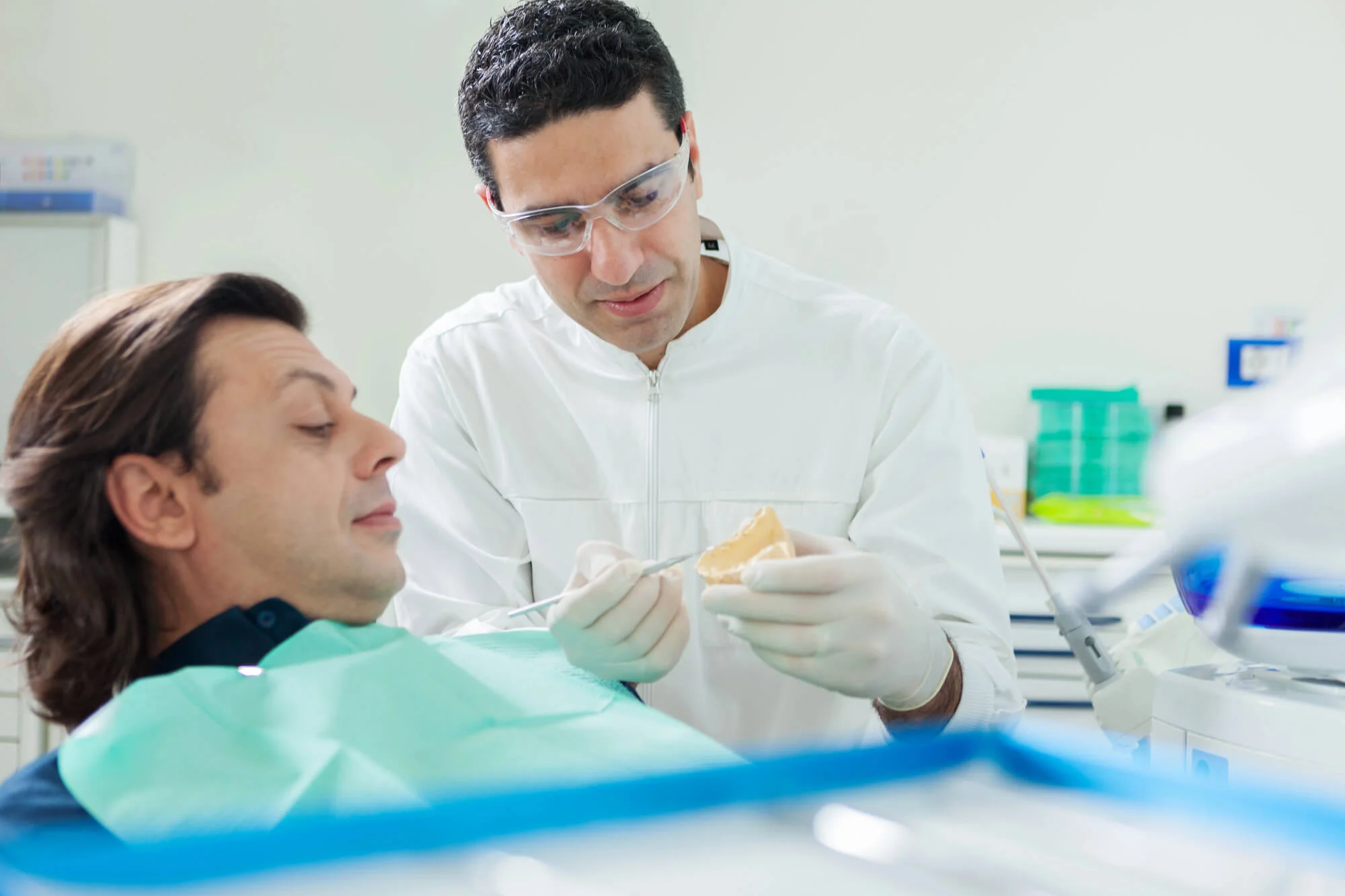 Dentist explaining implant options, dental implants near me