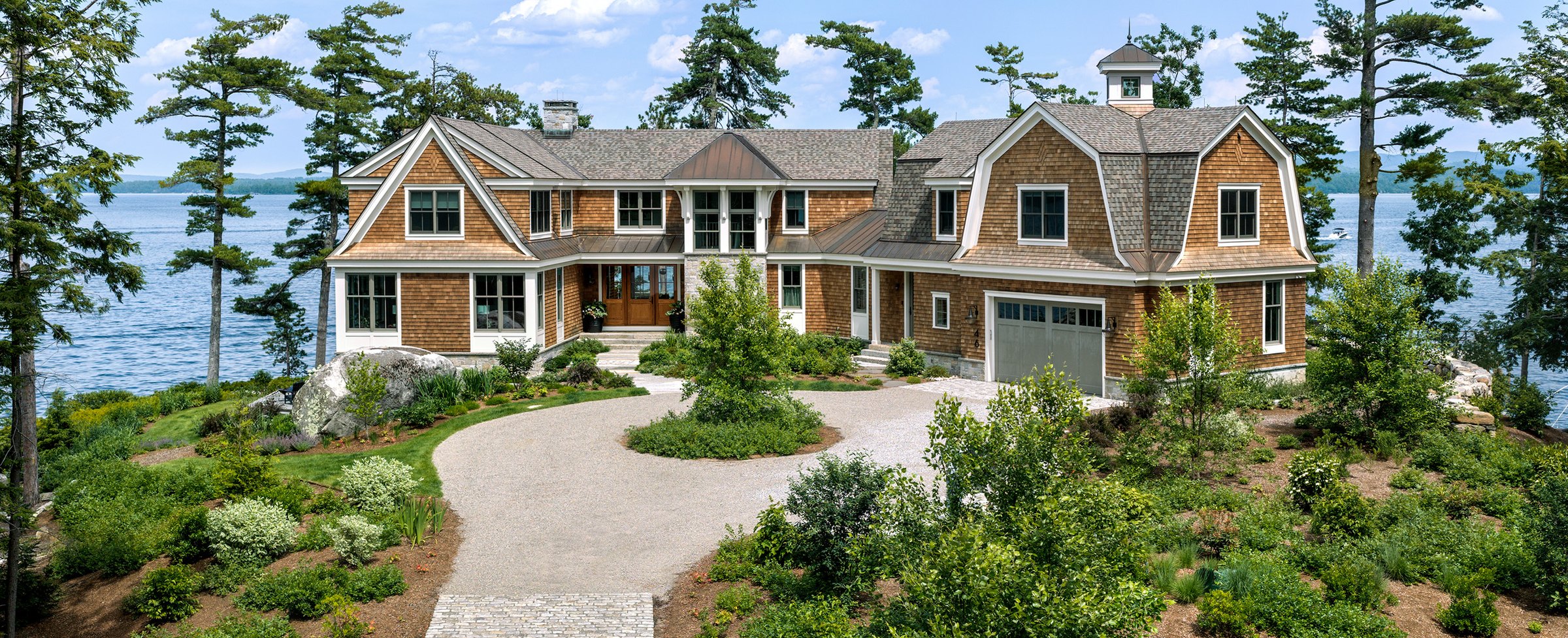 Lakefront shingle-style estate exterior painted by BLC Painting