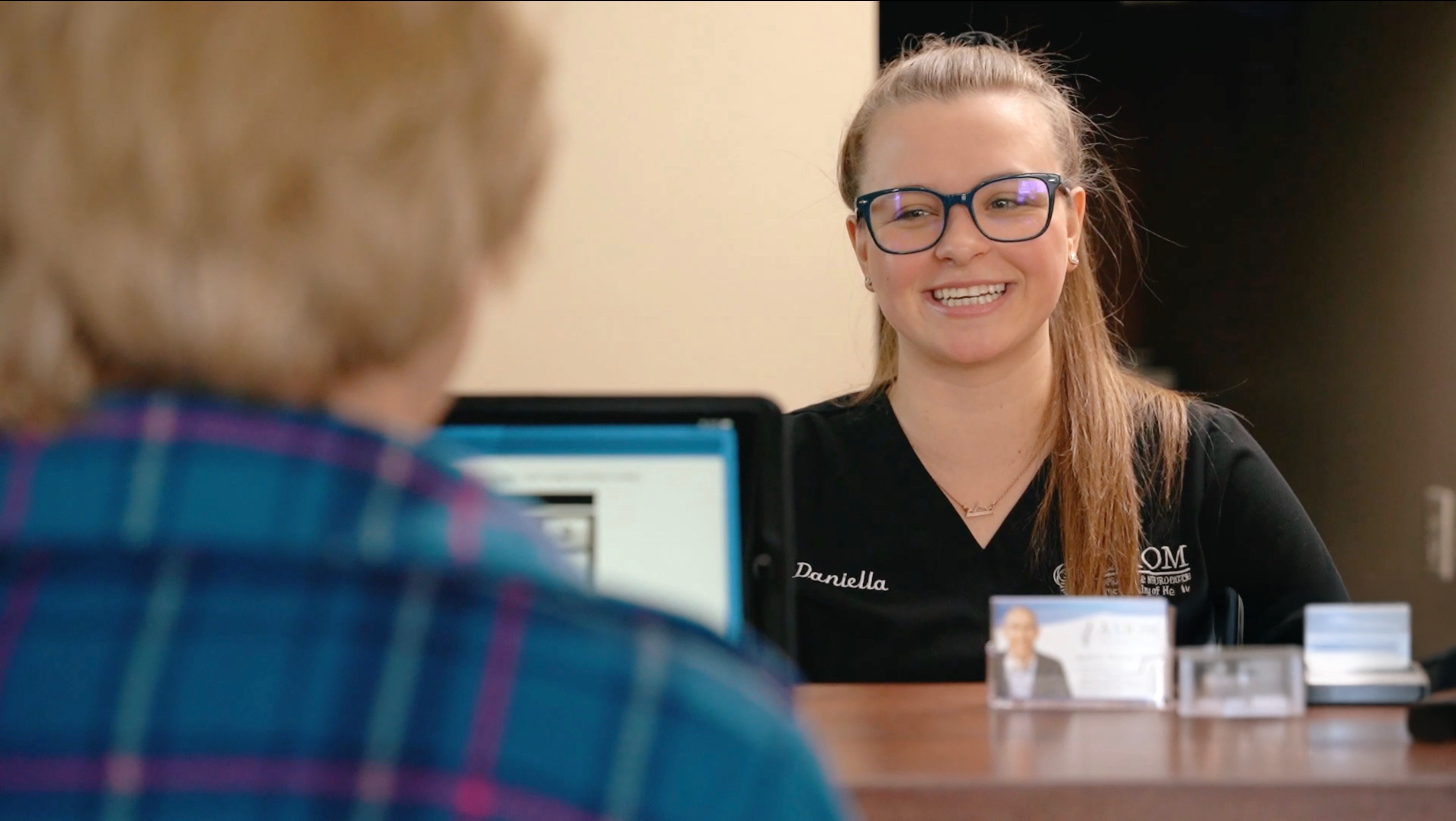 closeup of office manager and patient