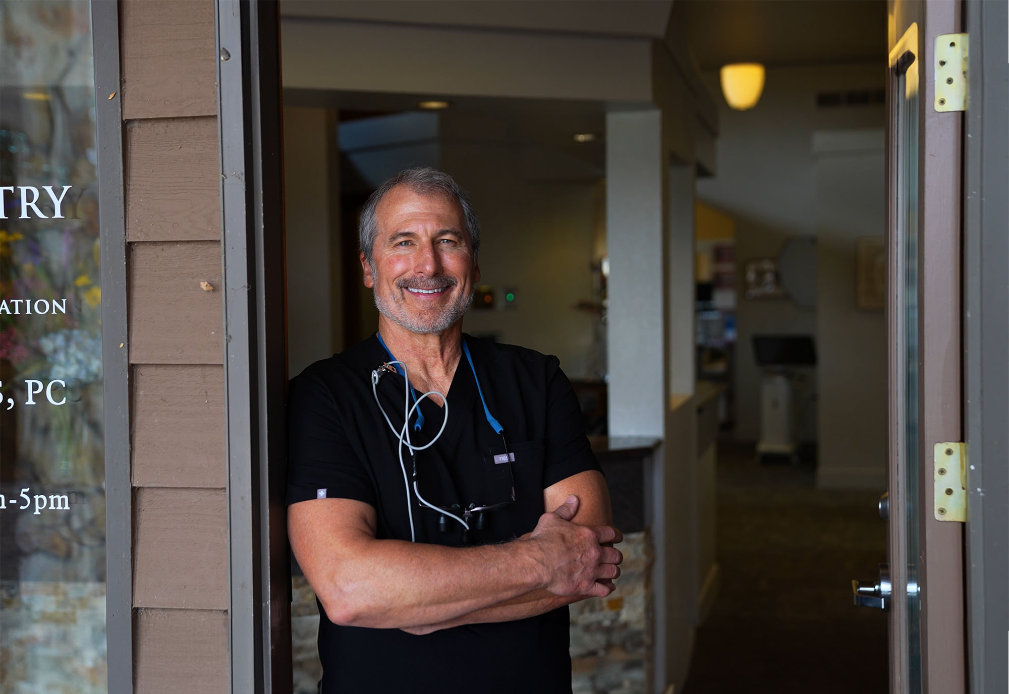 dr andrew howard standing outside his practice in loveland colorado