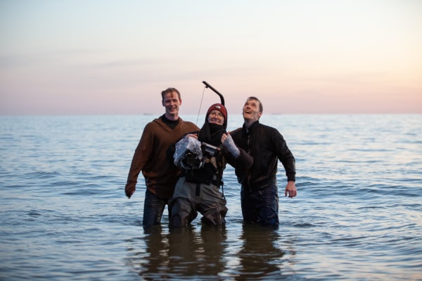 Great moods of 3 actors after filming on a beach set. Staing in water up to knees, fully clothed and in great mood actors